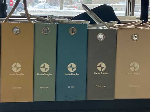Hunter Douglas branded cases displayed on a table